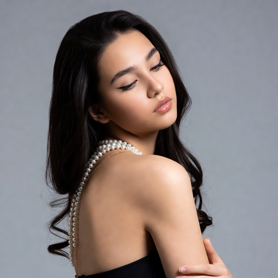 Asian woman with pearl necklace profile Asian woman with pearl necklace profile