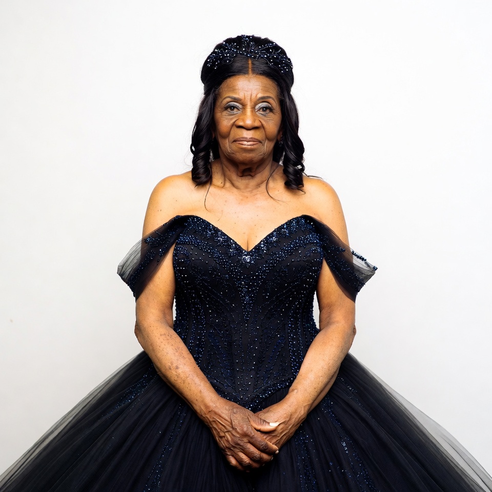 Elderly African-American woman in black gown Elderly African-American woman in black gown