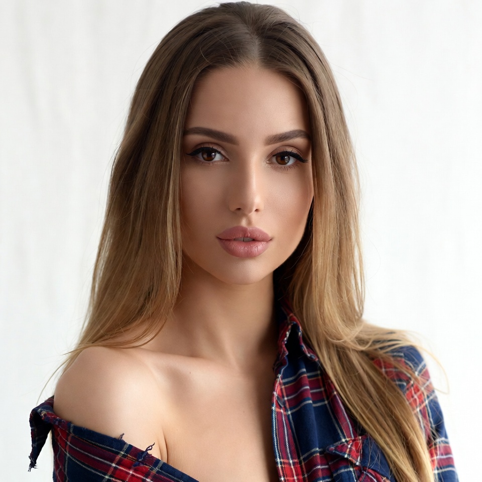 Woman in plaid off-shoulder shirt Woman in plaid off-shoulder shirt