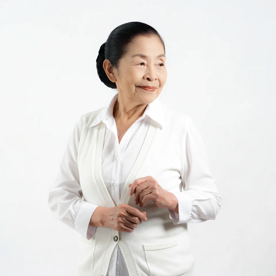 Elderly Asian woman in white cardigan Elderly Asian woman in white cardigan