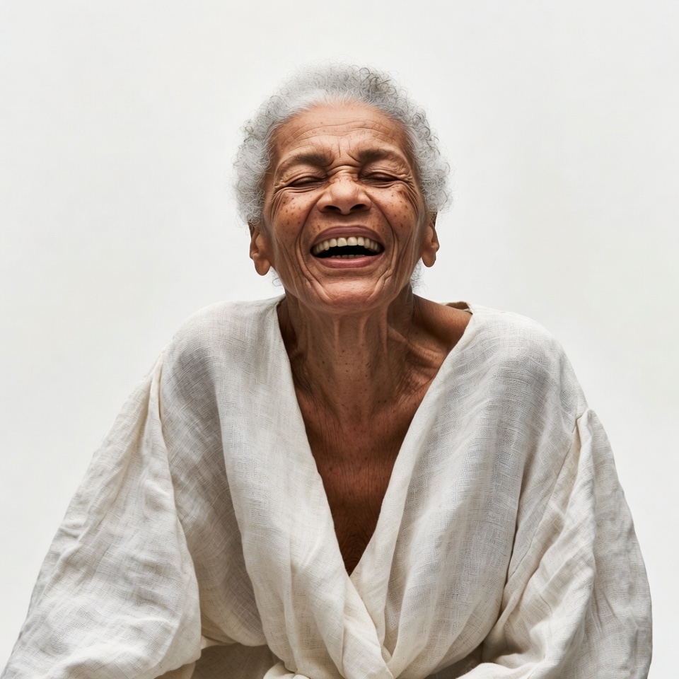 Elderly African-American woman laughing joyfully Elderly African-American woman laughing joyfully
