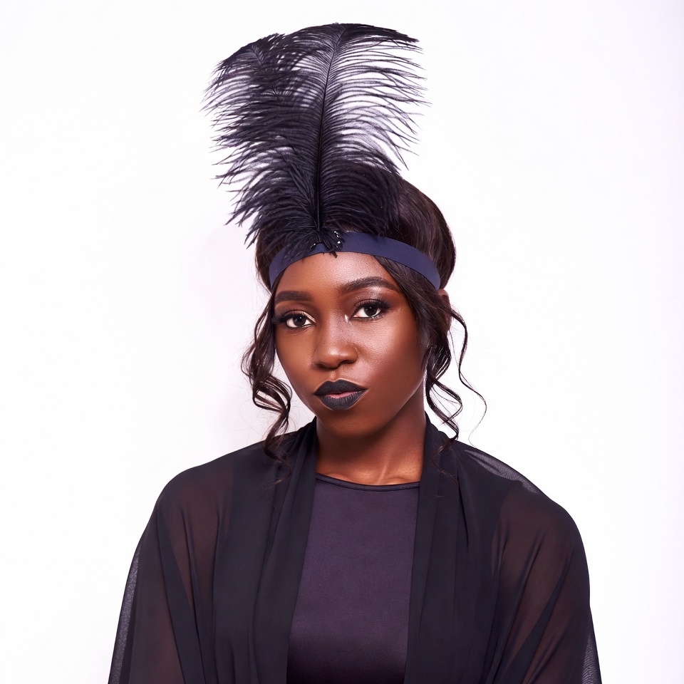 African-American woman in black feather headband African-American woman in black feather headband