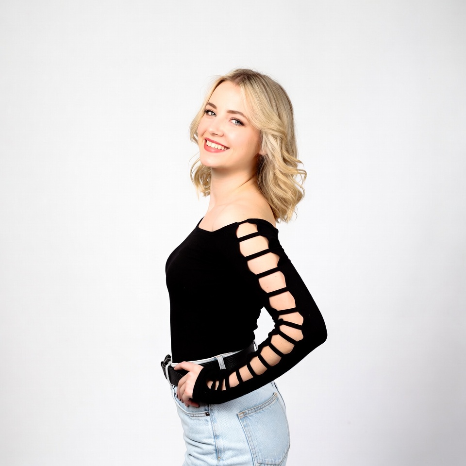 Blonde woman in black cutout top Blonde woman in black cutout top