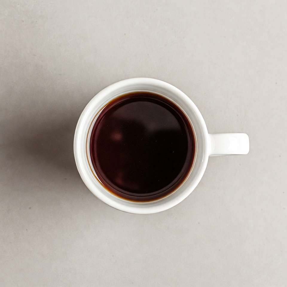 Top view of coffee in white mug Top view of coffee in white mug