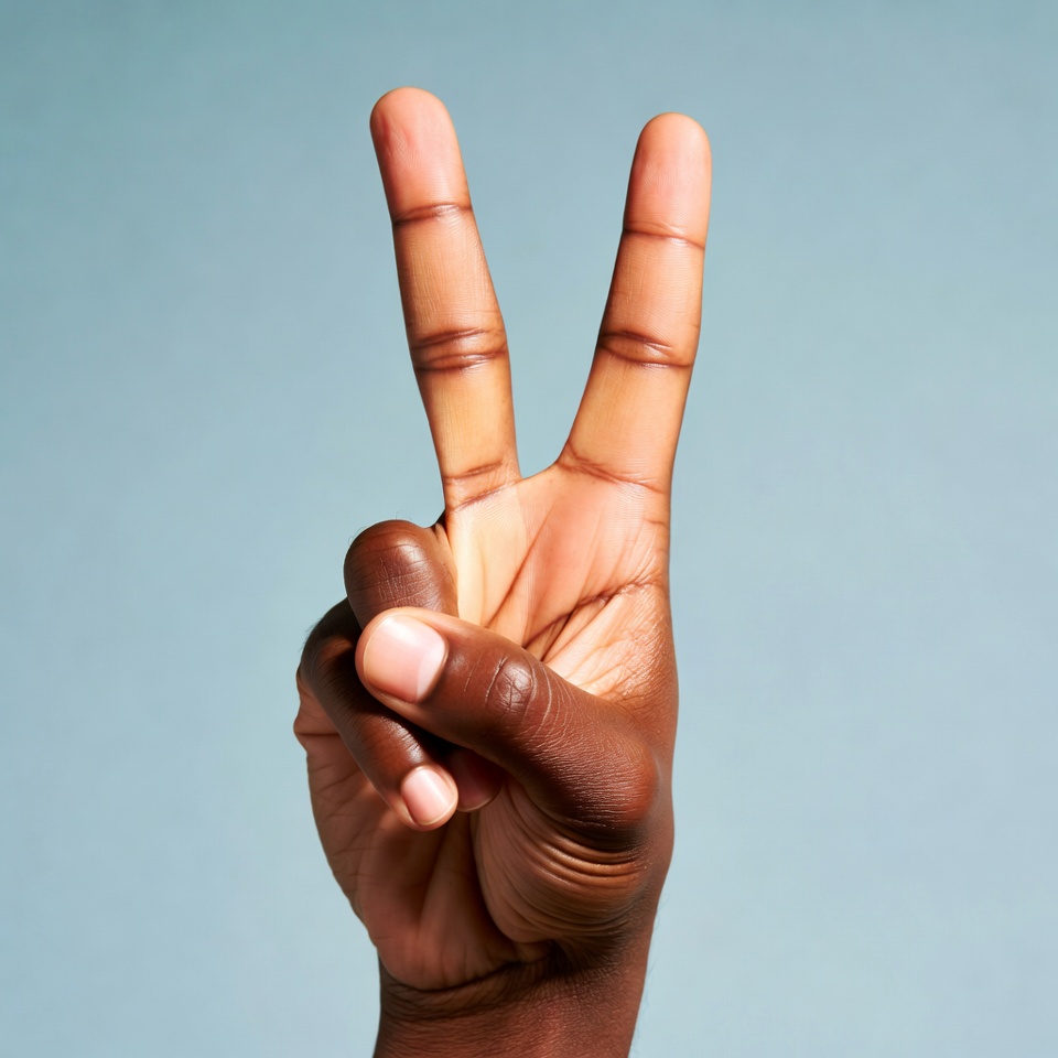 African-American hand making peace sign African-American hand making peace sign