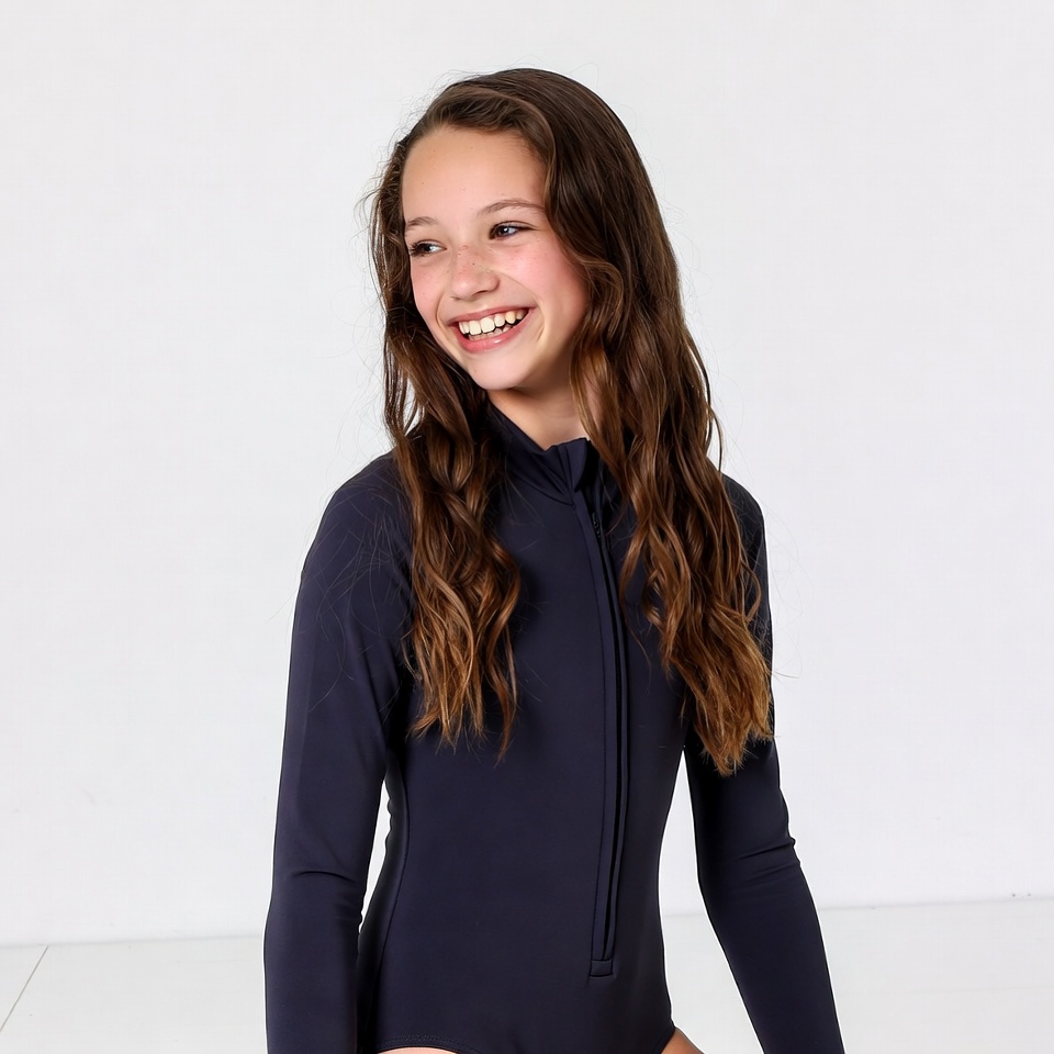 Smiling girl in navy wetsuit Smiling girl in navy wetsuit