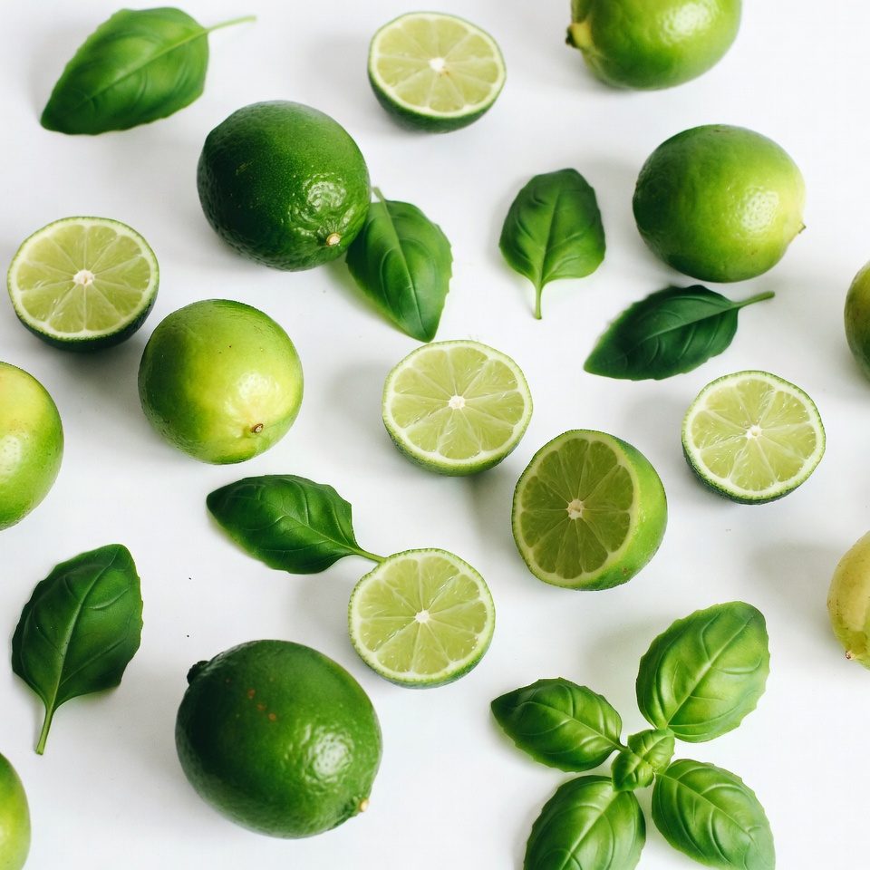 Fresh Limes and Basil Leaves Fresh Limes and Basil Leaves