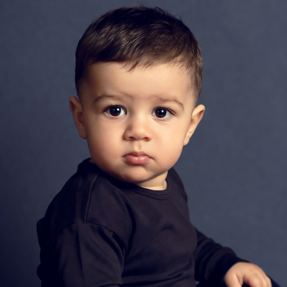 Baby boy with serious expression Baby boy with serious expression