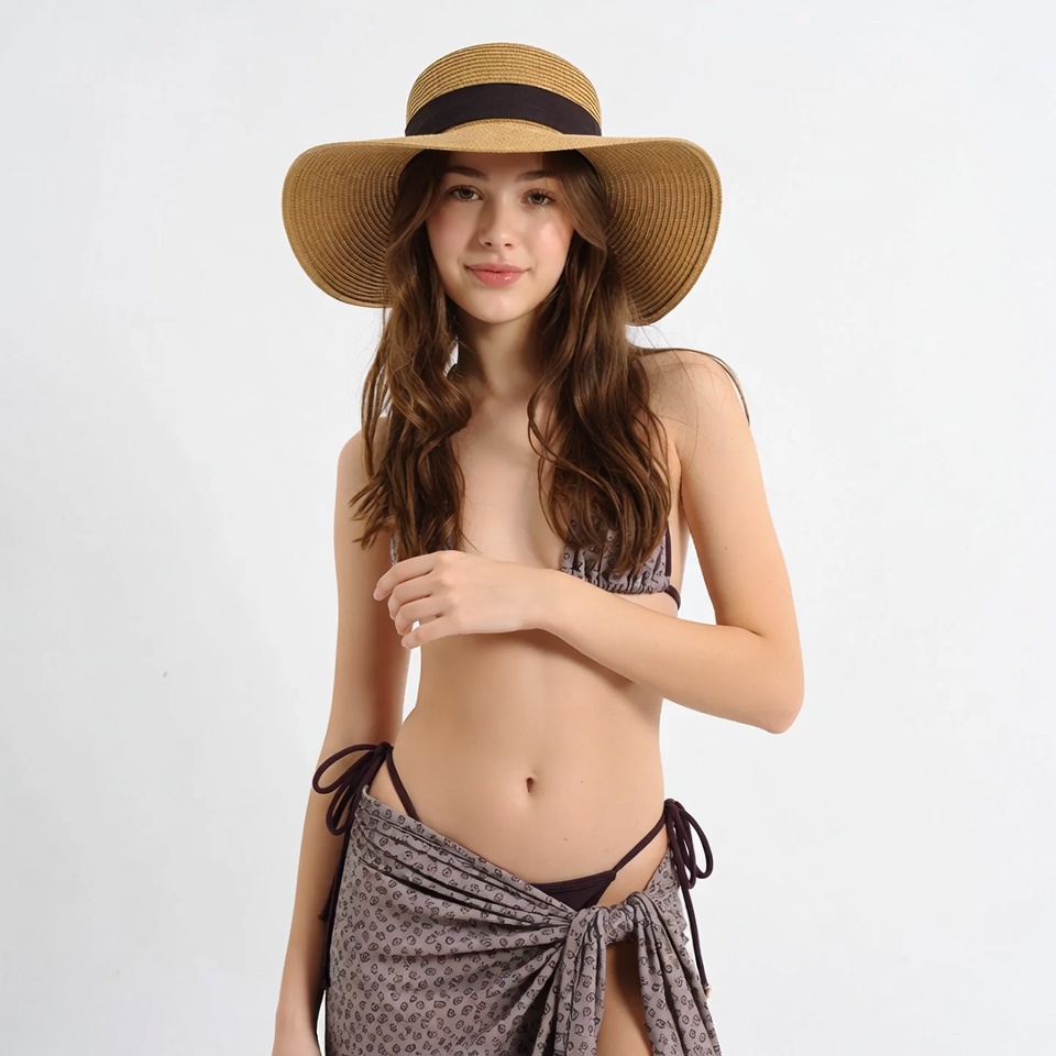 Young woman in bikini and straw hat Young woman in bikini and straw hat