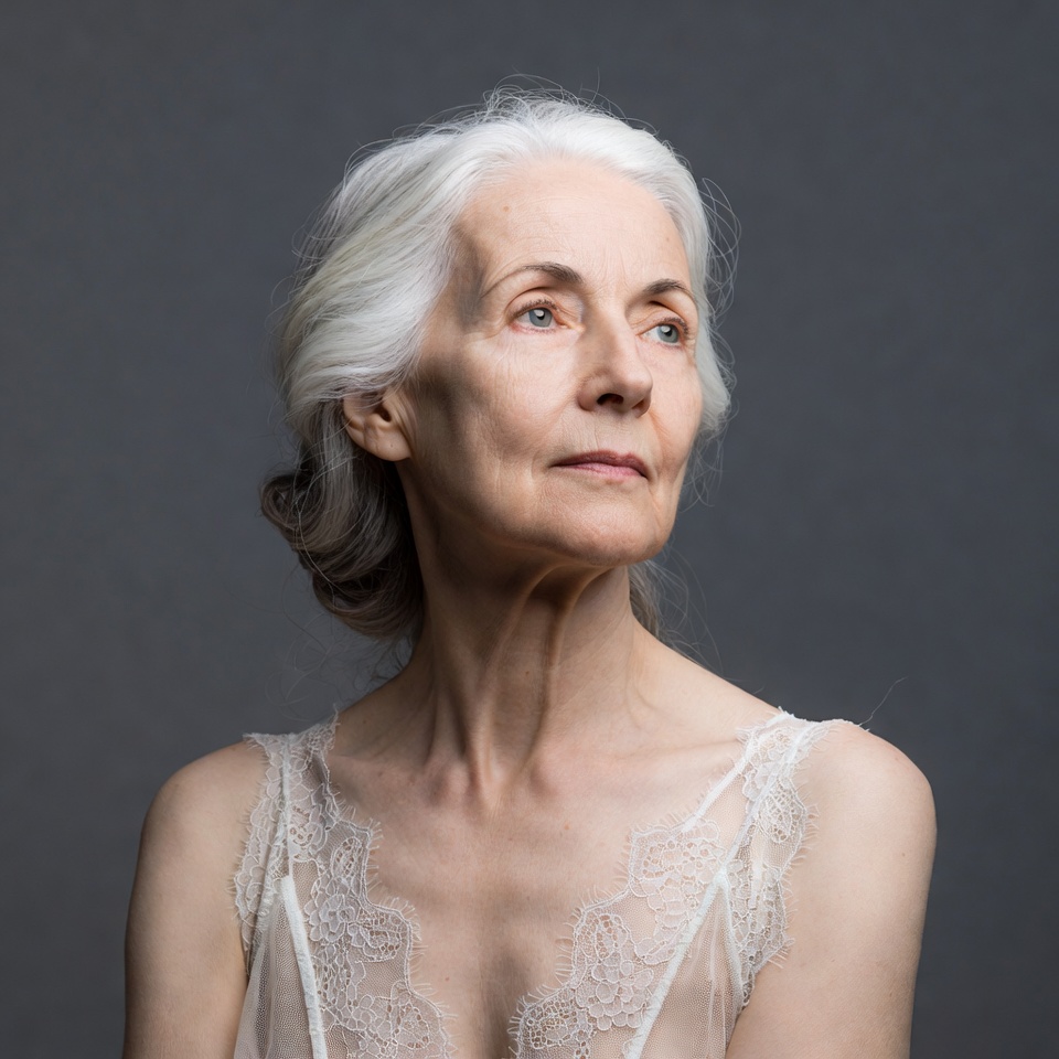 Elderly woman with silver hair looking up Elderly woman with silver hair looking up