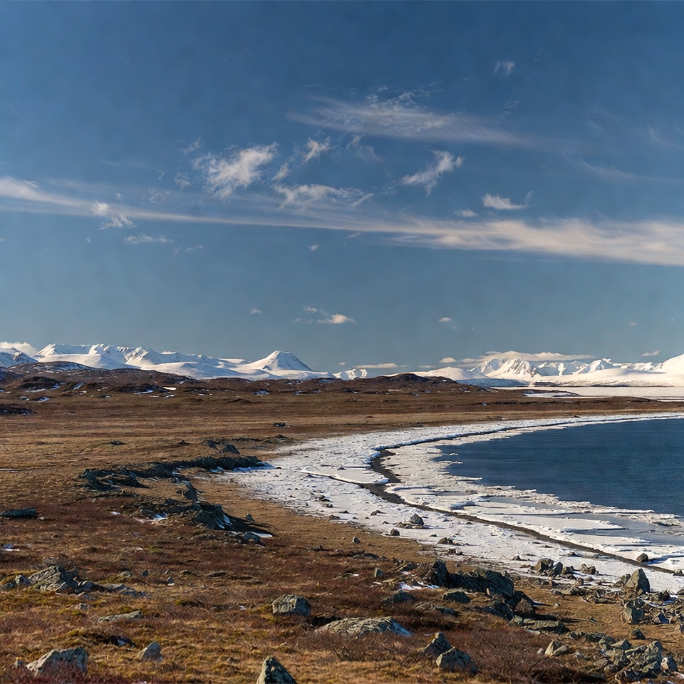 Snowy Mountains and Frozen Lake Shoreline Snowy Mountains and Frozen Lake Shoreline