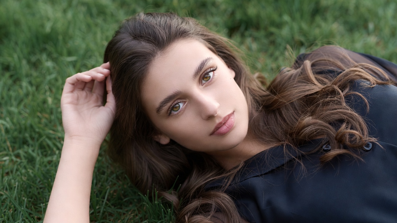 Beautiful woman lying on grass Beautiful woman lying on grass