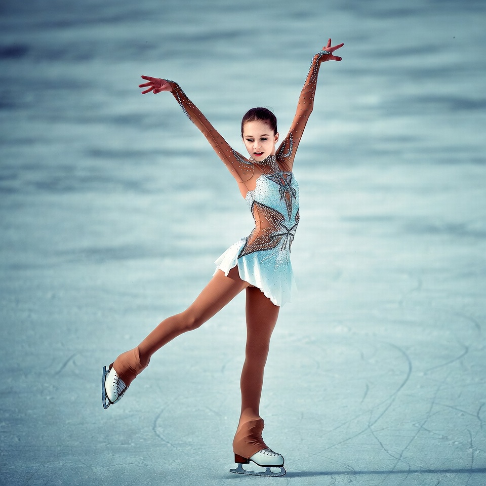 Young girl figure skating on ice Young girl figure skating on ice