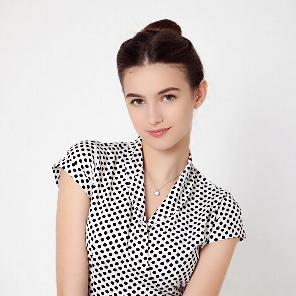 Young woman in polka dot blouse Young woman in polka dot blouse