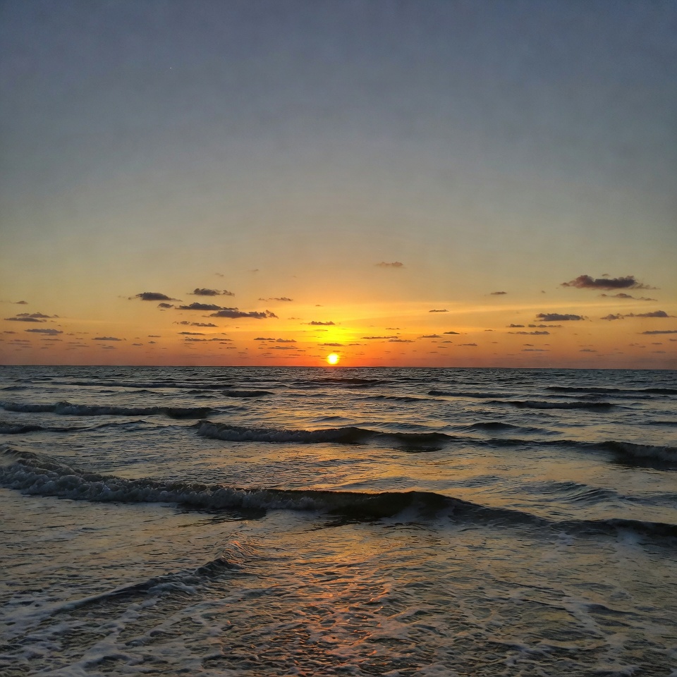 Sunset over ocean waves Sunset over ocean waves