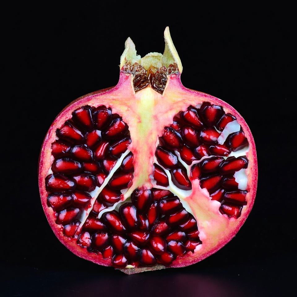 Cut Pomegranate on Black Background Cut Pomegranate on Black Background