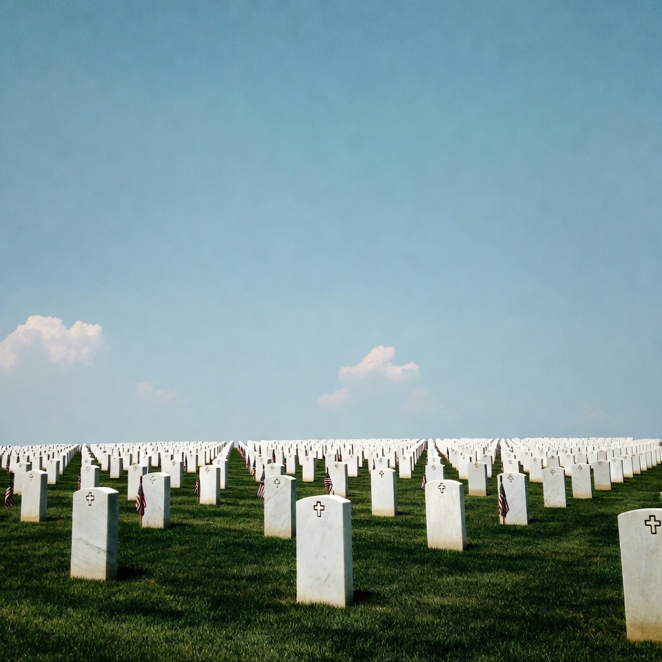 Rows of White Headstones in Cemetery Rows of White Headstones in Cemetery