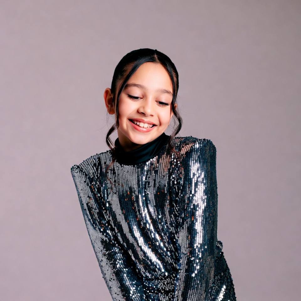 Smiling girl in sequin dress Smiling girl in sequin dress