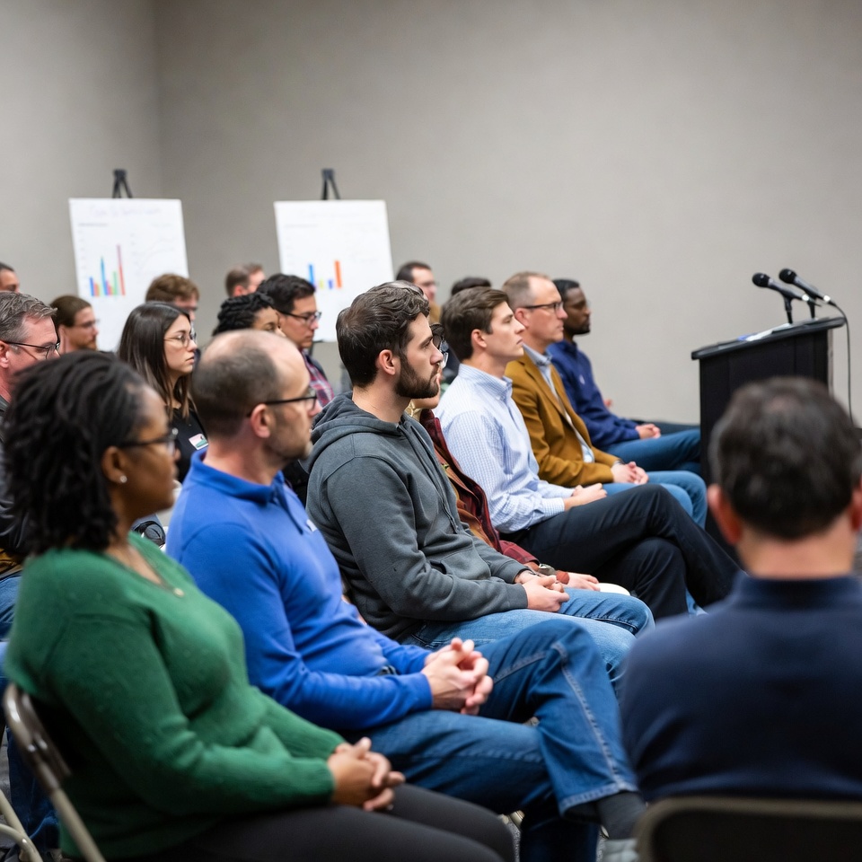 Diverse audience attending business presentation Diverse audience attending business presentation