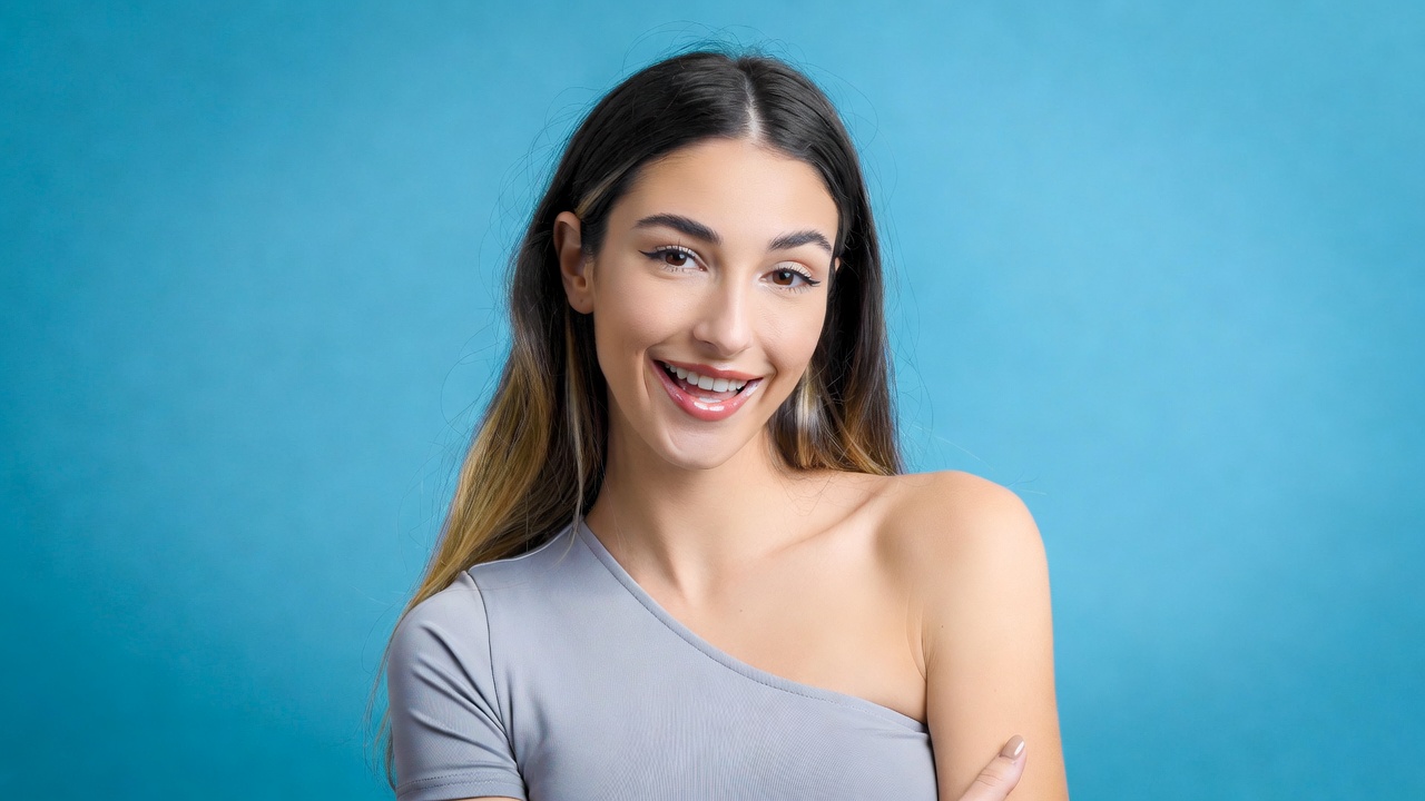 Smiling woman in gray one-shoulder top Smiling woman in gray one-shoulder top