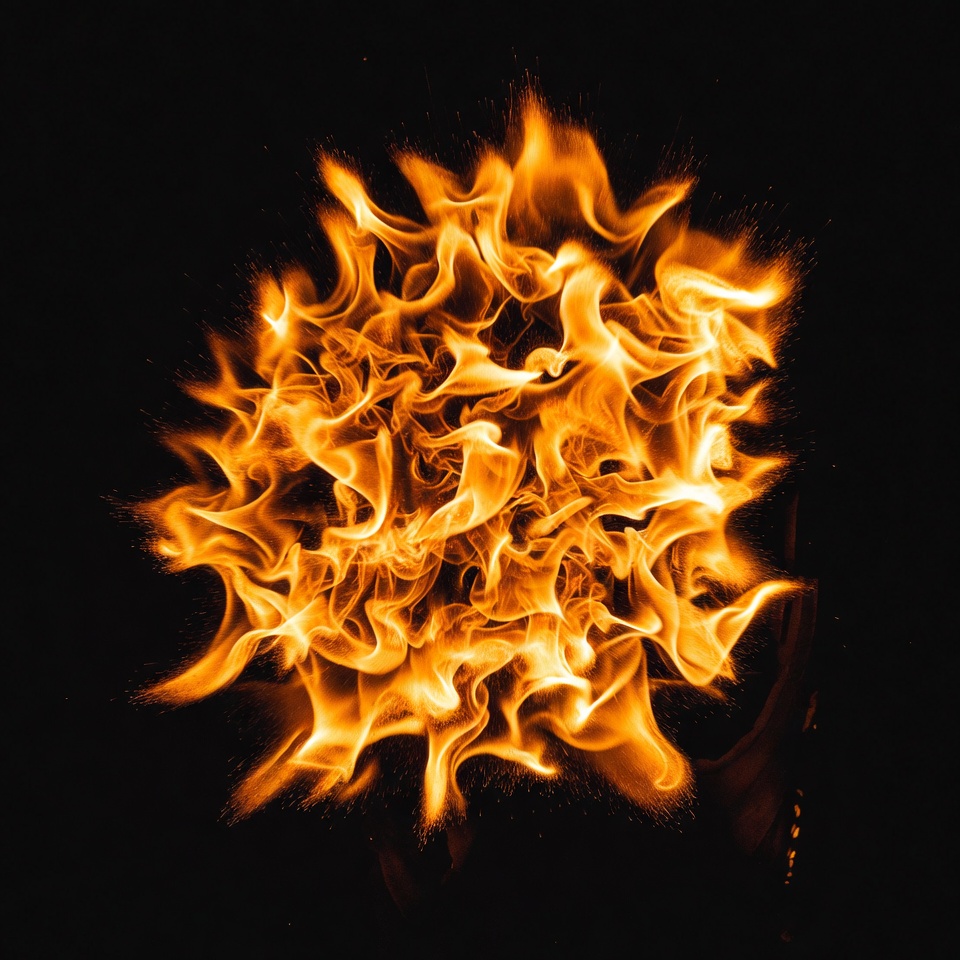 Fiery orange fireball on black Fiery orange fireball on black