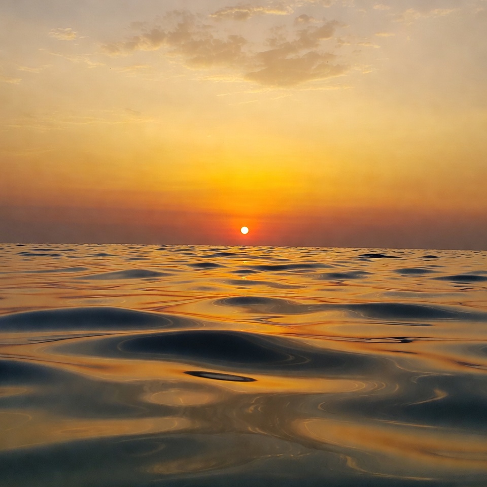 Sunset over ocean waves Sunset over ocean waves