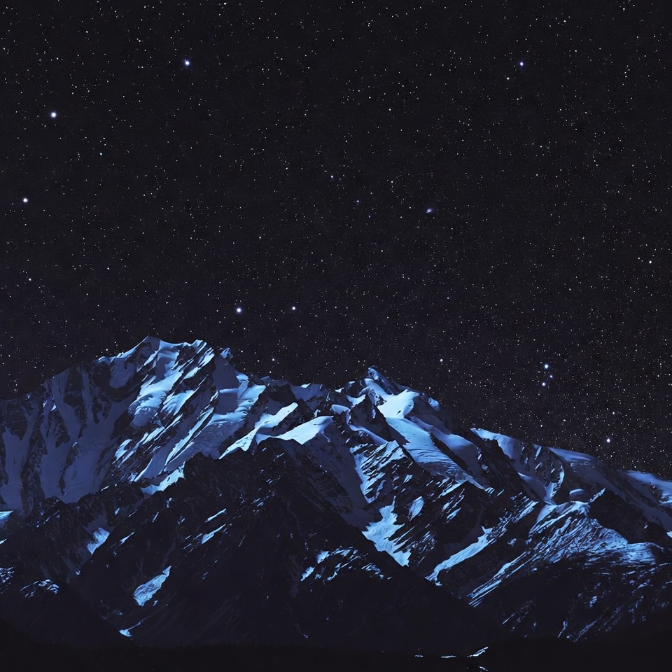Snowy Mountains Under Starry Night Sky Snowy Mountains Under Starry Night Sky