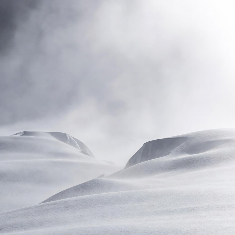 Snowy Mountains in Foggy Landscape Snowy Mountains in Foggy Landscape