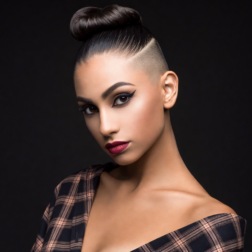 Woman with undercut bun hairstyle Woman with undercut bun hairstyle