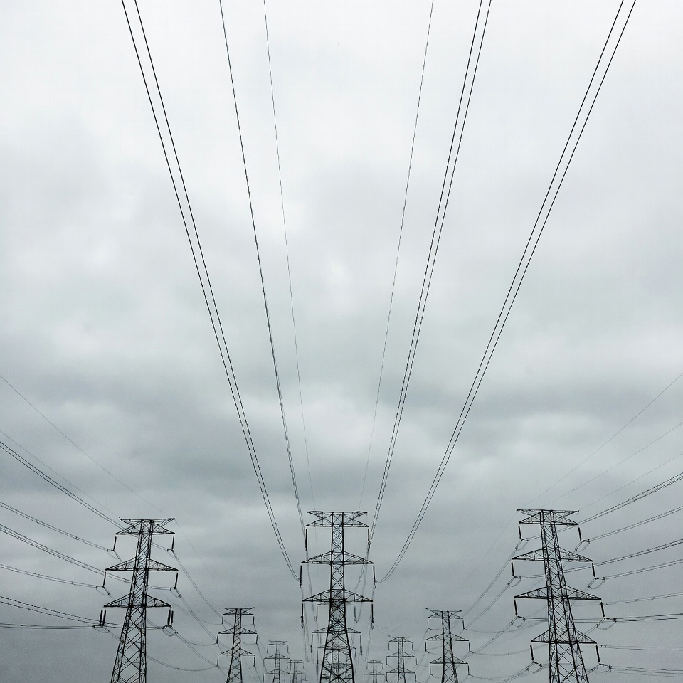 Electricity Pylons Under Cloudy Sky Electricity Pylons Under Cloudy Sky
