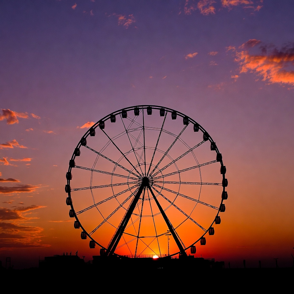 Ferris wheel silhouette at sunset Ferris wheel silhouette at sunset