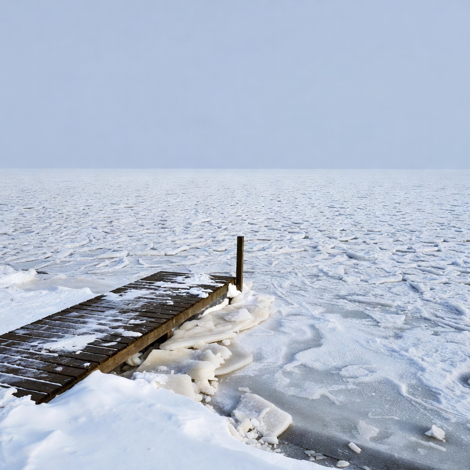 Wooden pier on frozen lake Wooden pier on frozen lake
