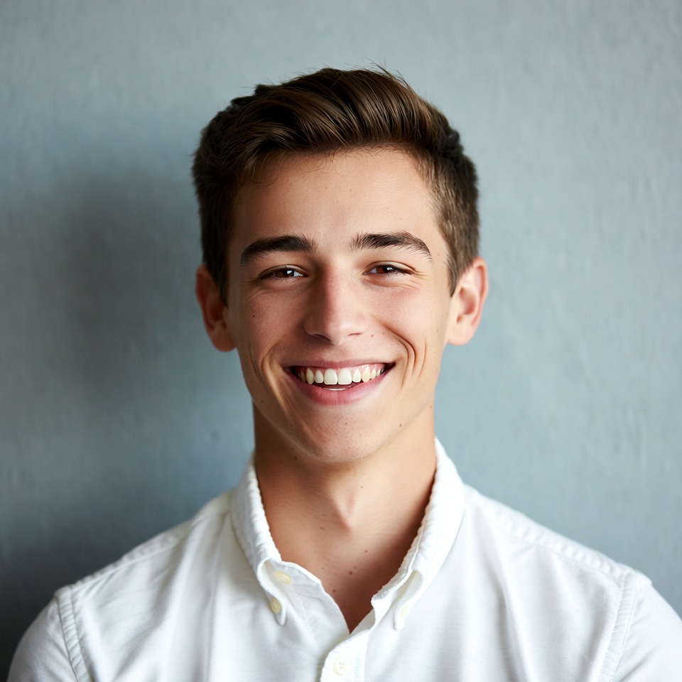 Smiling young man in white shirt Smiling young man in white shirt