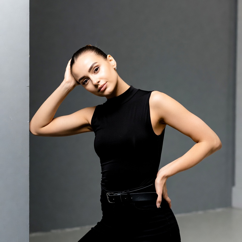 Woman posing in black turtleneck top Woman posing in black turtleneck top