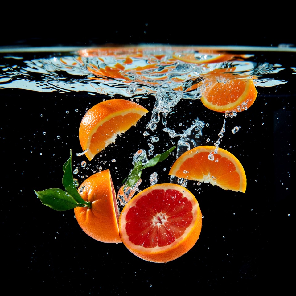 Oranges and Grapefruit Slices in Water Splash Oranges and Grapefruit Slices in Water Splash