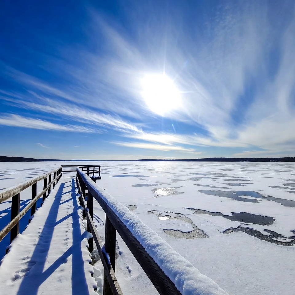 Wooden pier over frozen lake Wooden pier over frozen lake