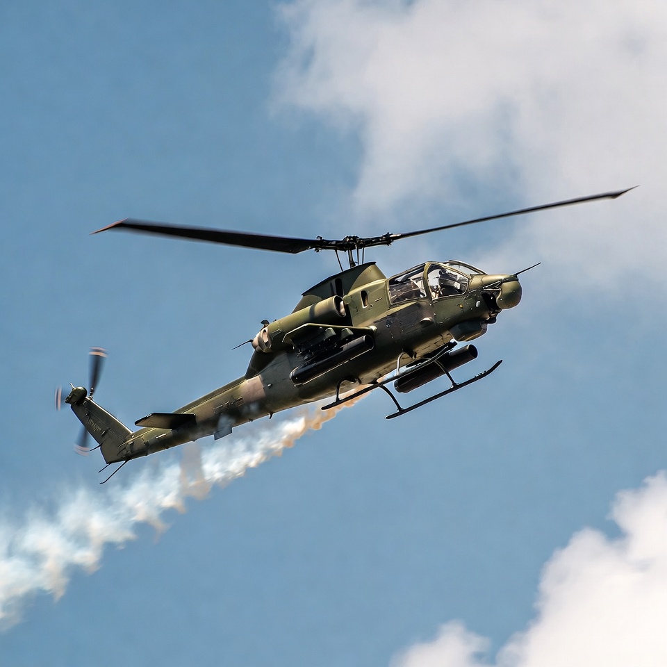 UH-1 Huey Helicopter Flying with Smoke Trail UH-1 Huey Helicopter Flying with Smoke Trail