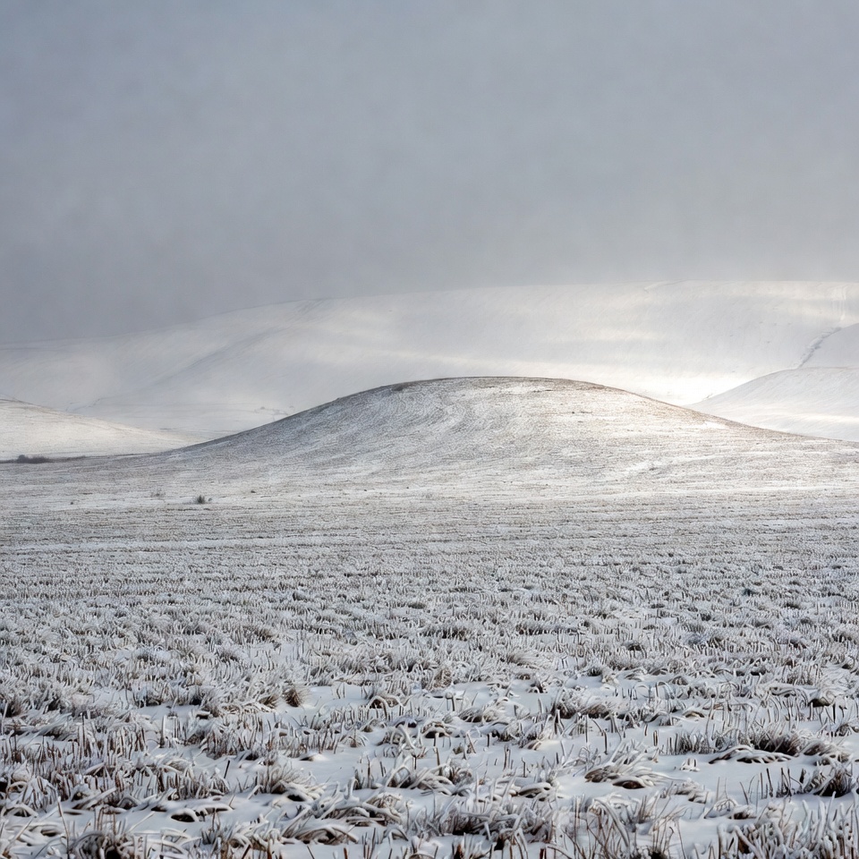 Snowy Hill in Vast Winter Field Snowy Hill in Vast Winter Field