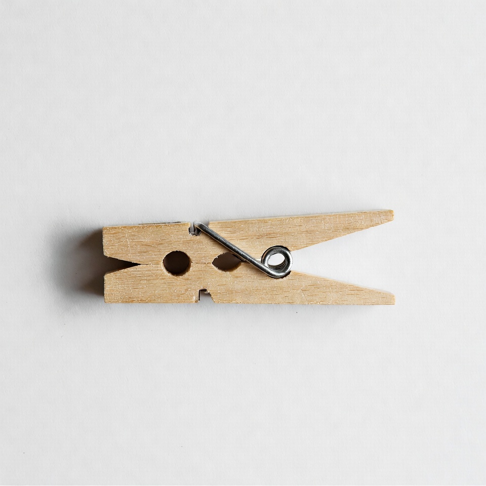 Wooden clothespin on white background Wooden clothespin on white background