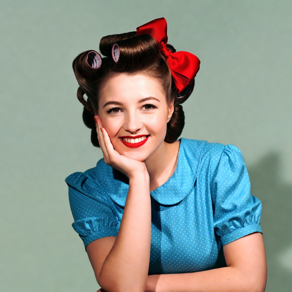 Woman with curlers and red bow Woman with curlers and red bow