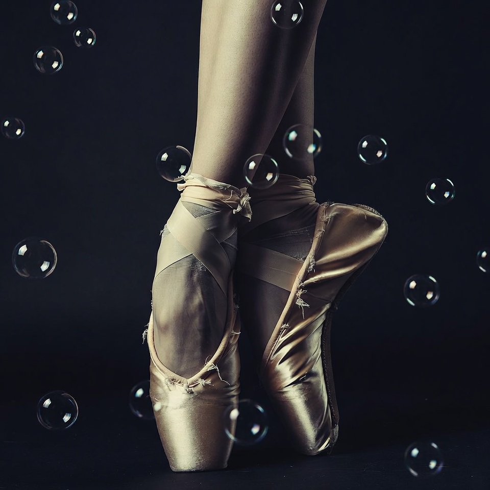 Ballerina legs with pointe shoes and bubbles Ballerina legs with pointe shoes and bubbles