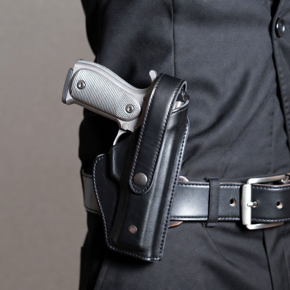 Police Officer Holstering Handgun Police Officer Holstering Handgun