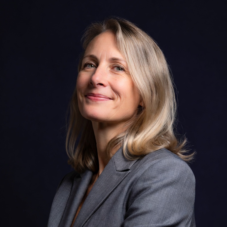 Smiling woman in gray suit Smiling woman in gray suit
