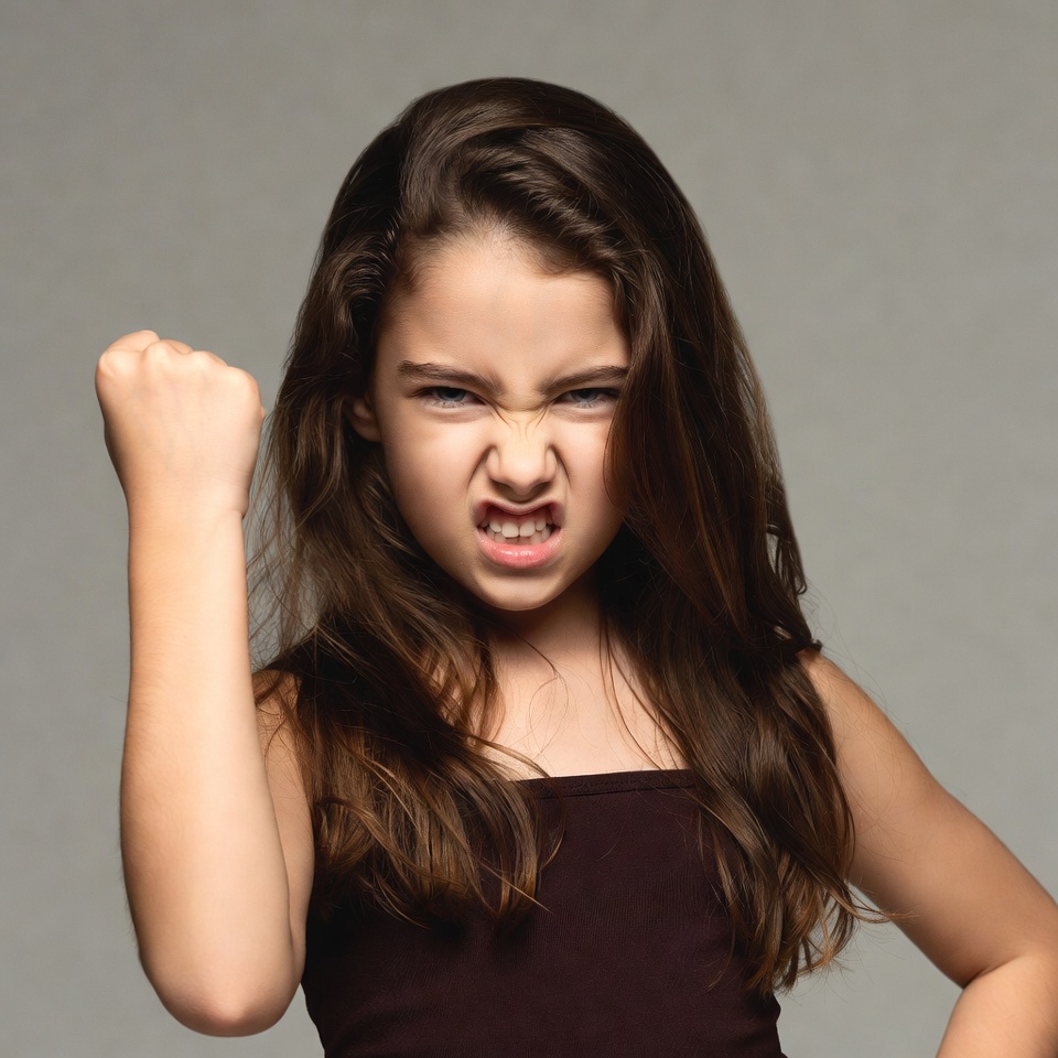 Angry girl clenching fist Angry girl clenching fist