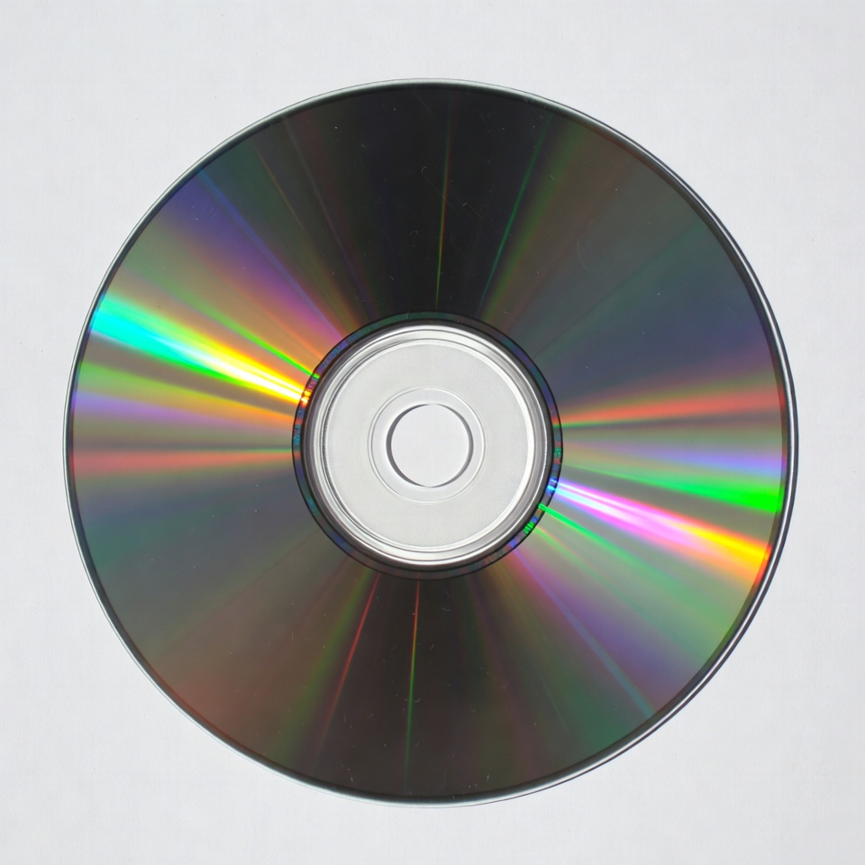 Shiny CD Disc on White Background Shiny CD Disc on White Background