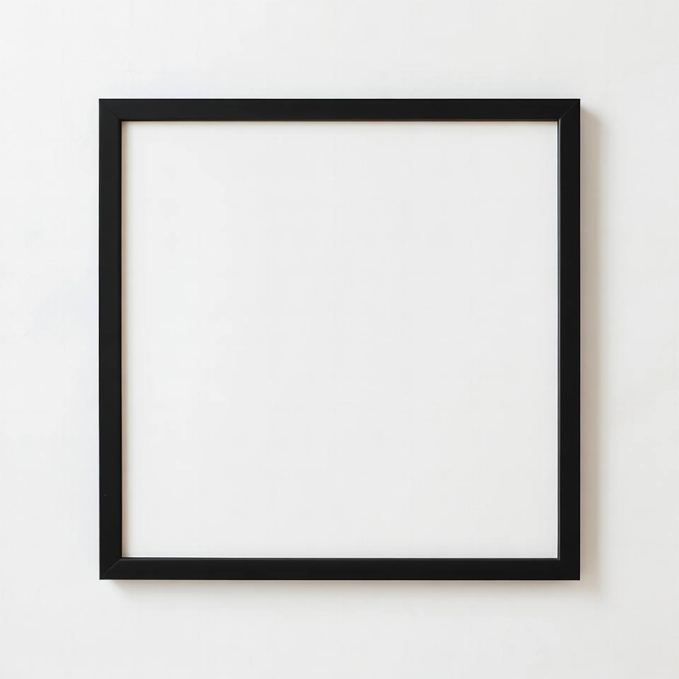 Empty Black Picture Frame on White Wall Empty Black Picture Frame on White Wall