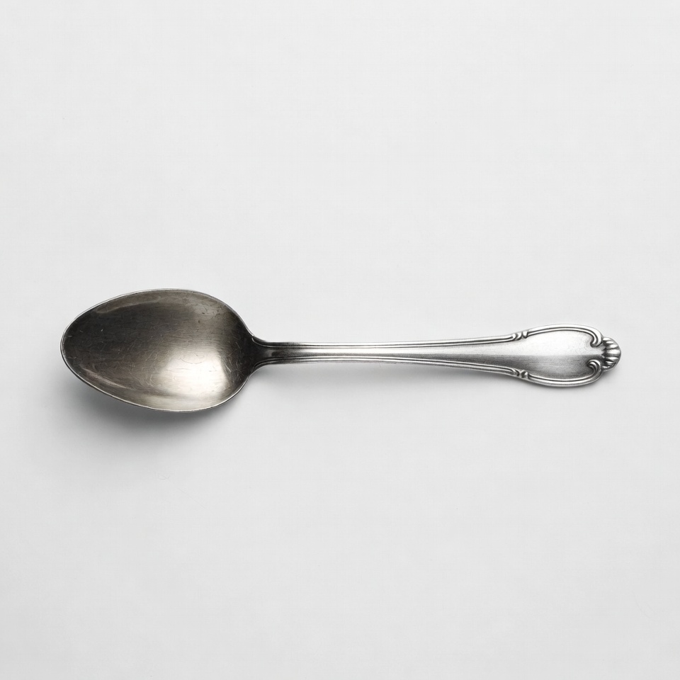 Silver spoon on white background Silver spoon on white background