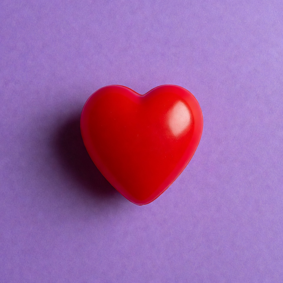 Red heart on purple background Red heart on purple background