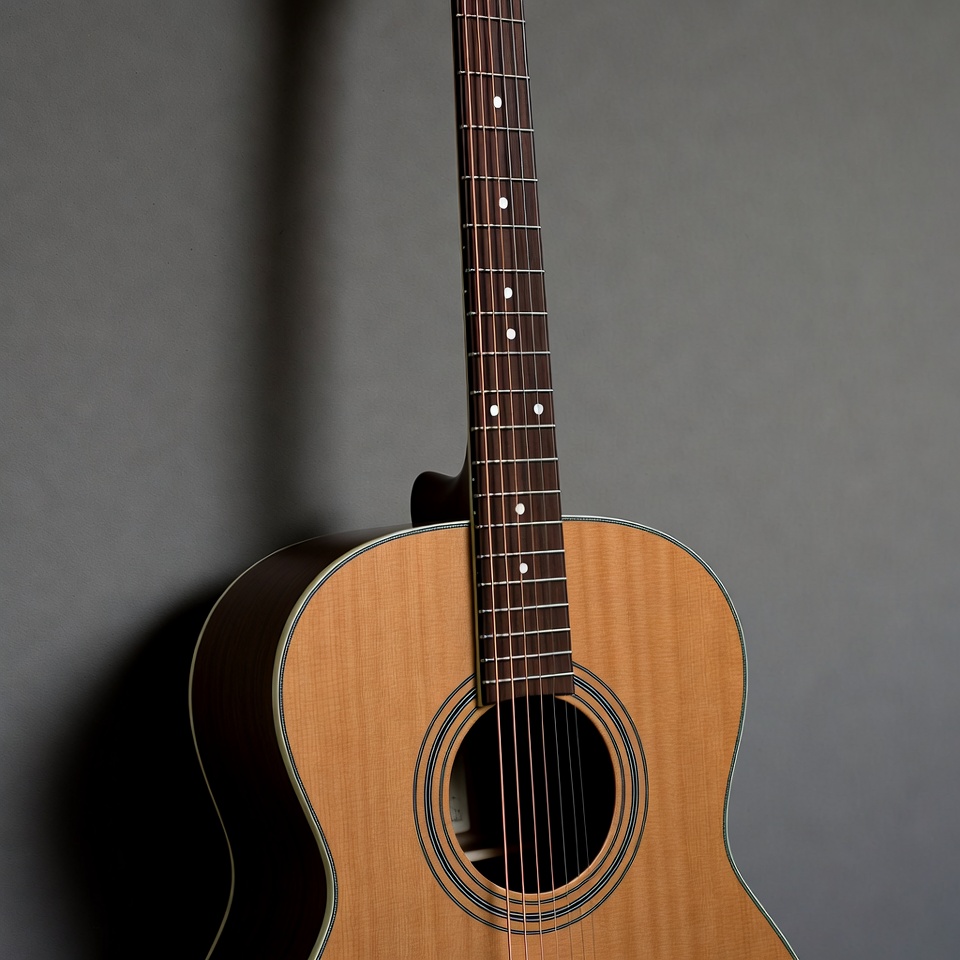 Acoustic Guitar Against Gray Wall Acoustic Guitar Against Gray Wall
