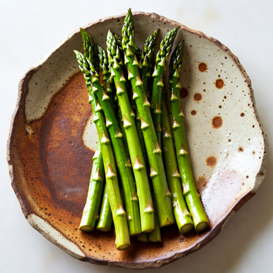 Fresh asparagus on ceramic plate Fresh asparagus on ceramic plate